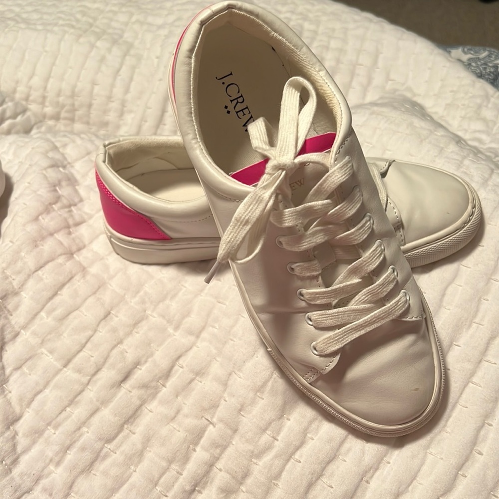 J crew white tennis shoes with hot pink accent.  Worn a handful of times.